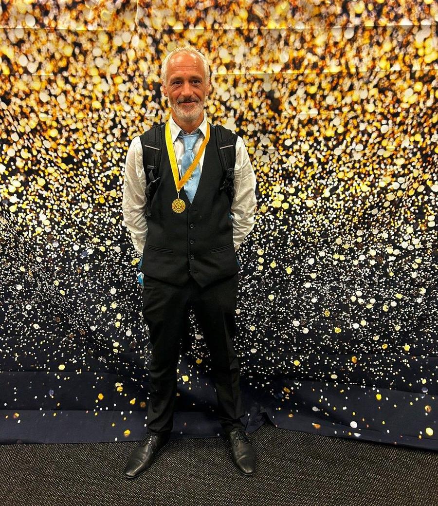 Darren Carter wearing the Hearts of Gold medal